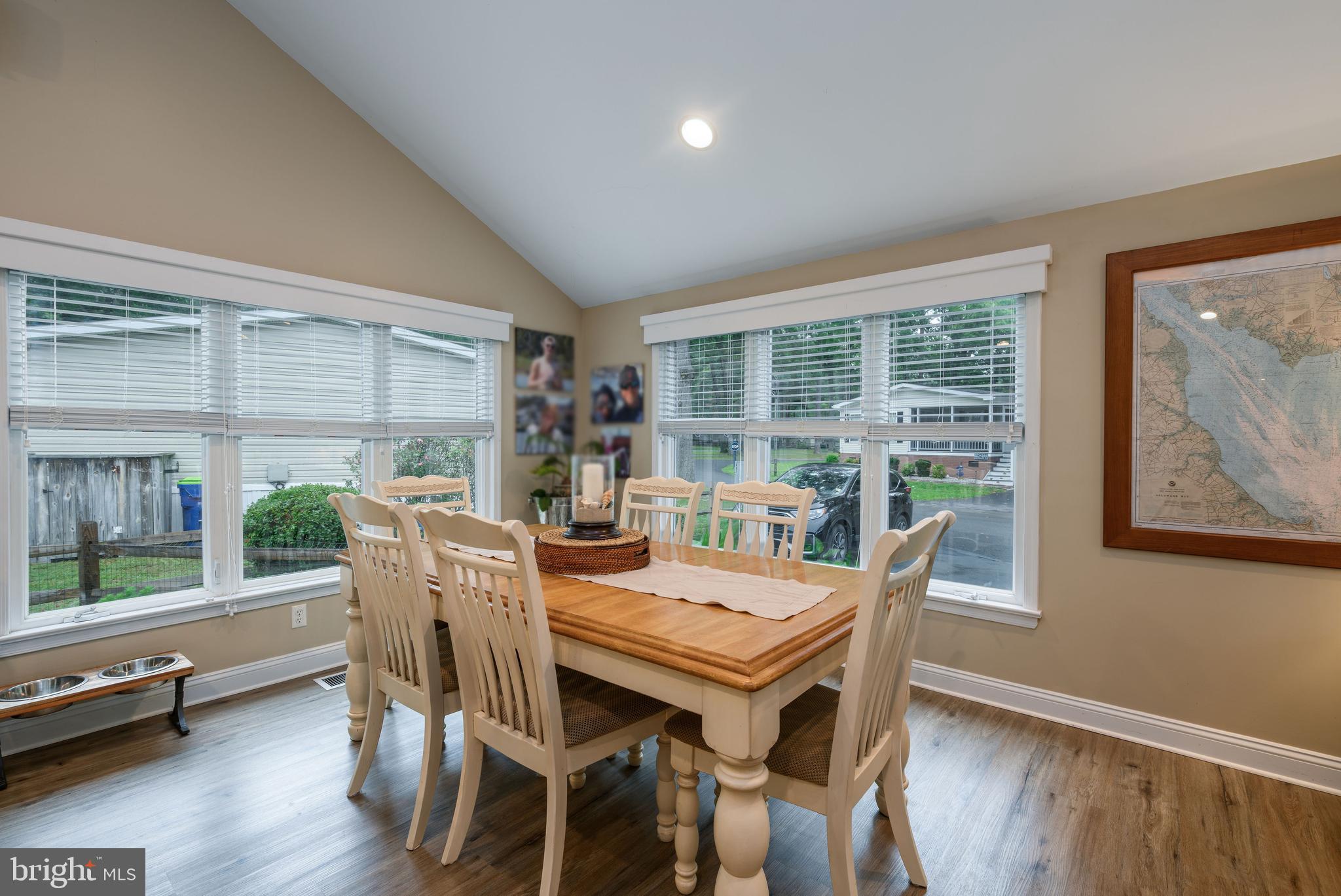 34386 Mallard Road, Unit 482 Long Neck, DE 19966 - Photo 10 of 41 a view of a dining room with furniture window and wooden floor