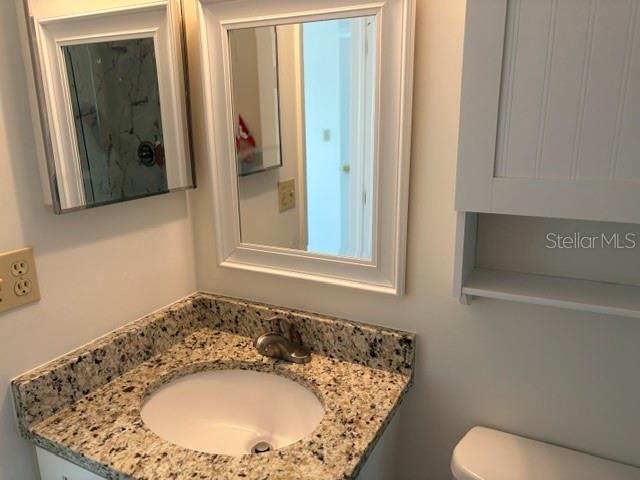 25225 Rampart Boulevard, Unit 1702 Punta Gorda, FL 33983 - Photo 14 of 19 a bathroom with a sink and a mirror