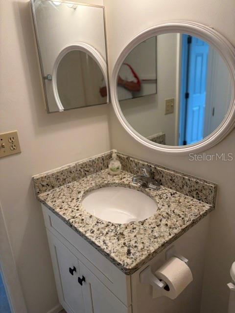 25225 Rampart Boulevard, Unit 1702 Punta Gorda, FL 33983 - Photo 18 of 19 a bathroom with a sink and mirror