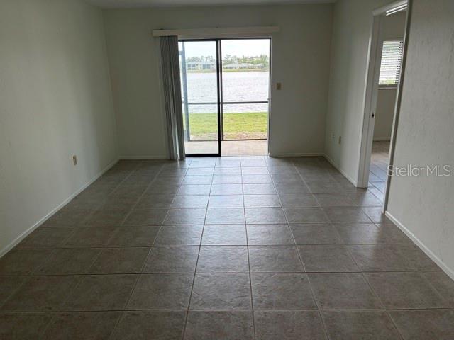 25225 Rampart Boulevard, Unit 1702 Punta Gorda, FL 33983 - Photo 6 of 19 a view of an empty room and window