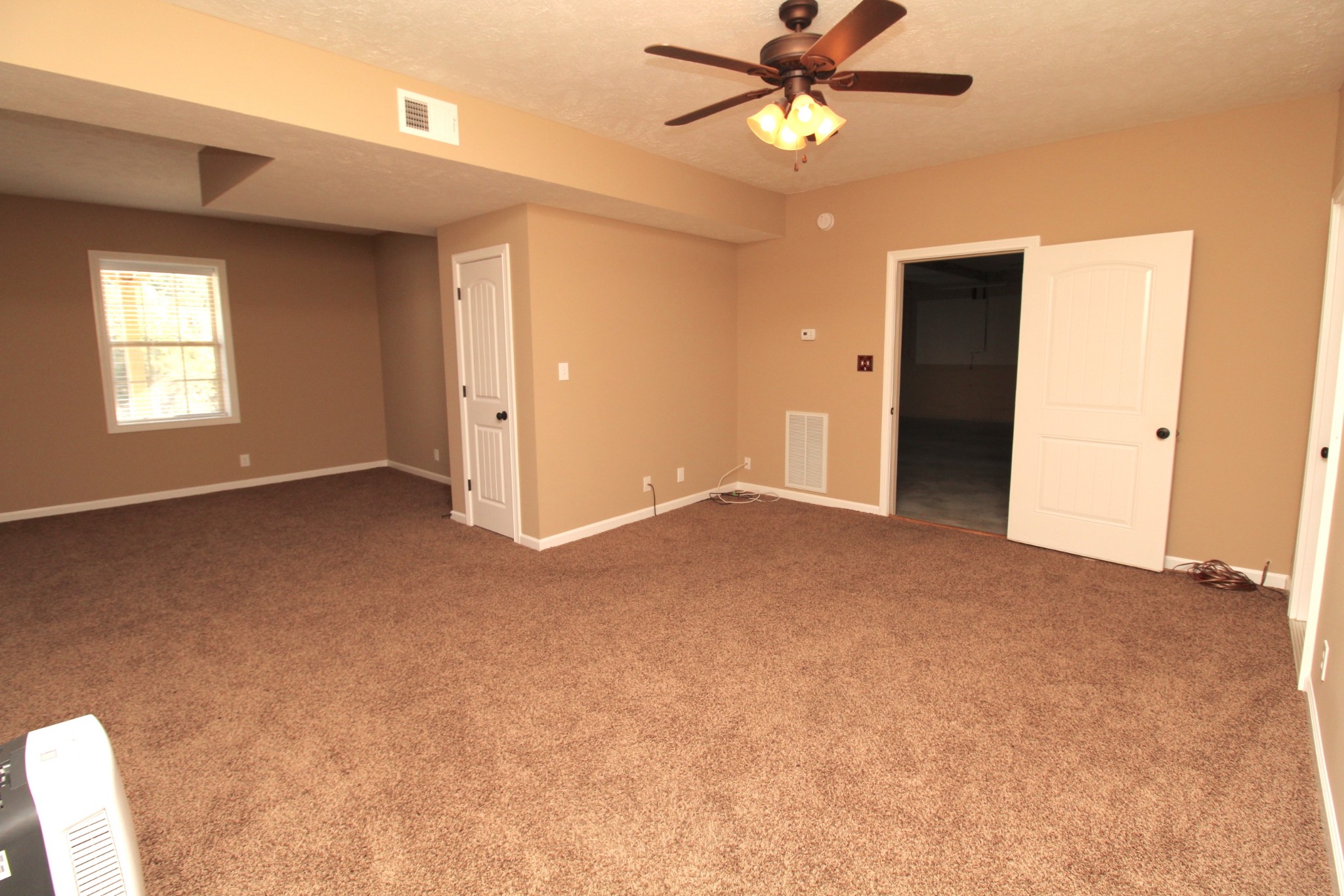834 7 Mile Ferry Road Clarksville, TN 37040 - Photo 12 of 15 a view of a big room with chandelier fan and windows