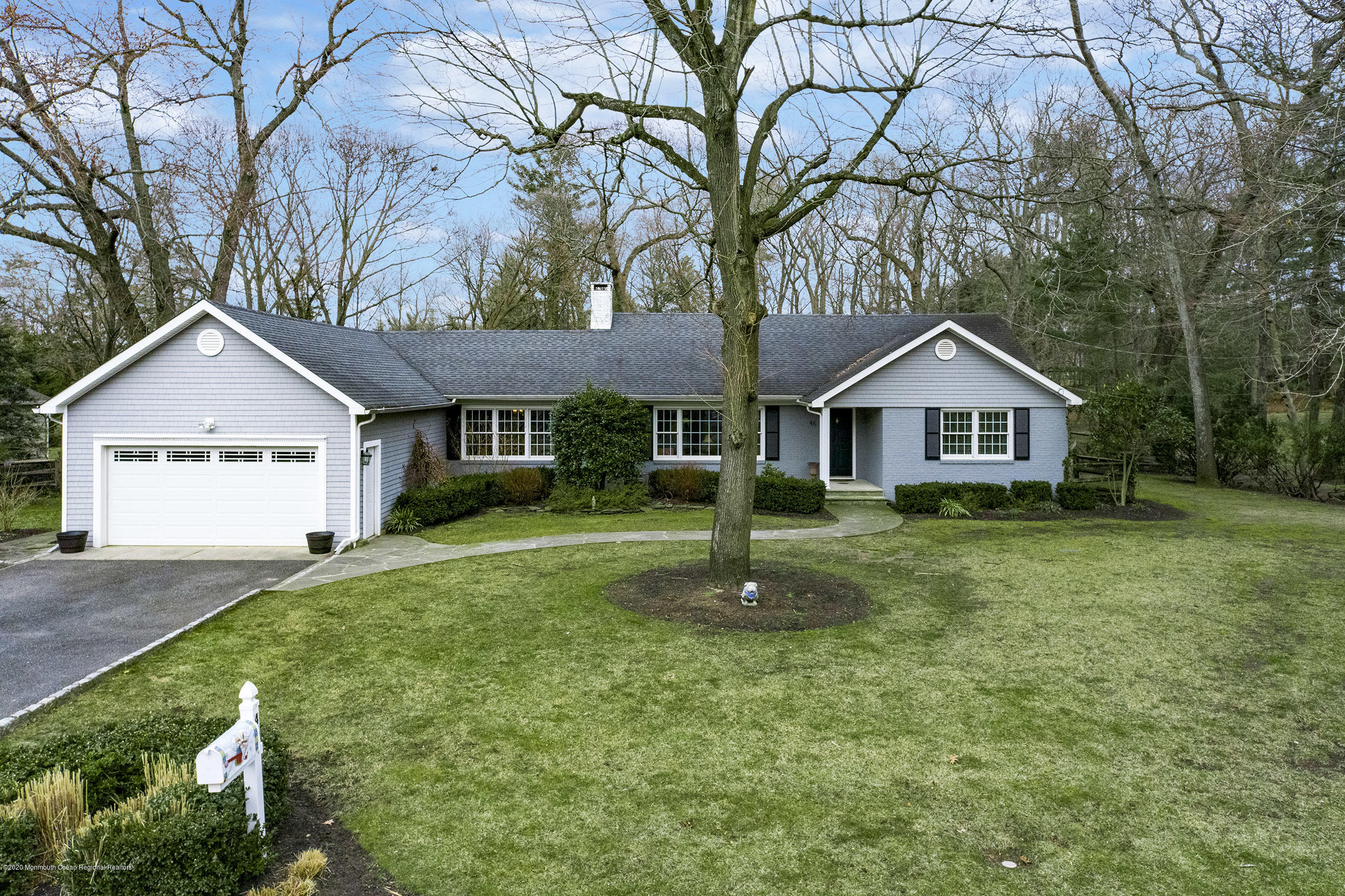 45 Hance Road Fair Haven, NJ 07704 - Photo 1 of 35 a front view of a house with a yard and garage