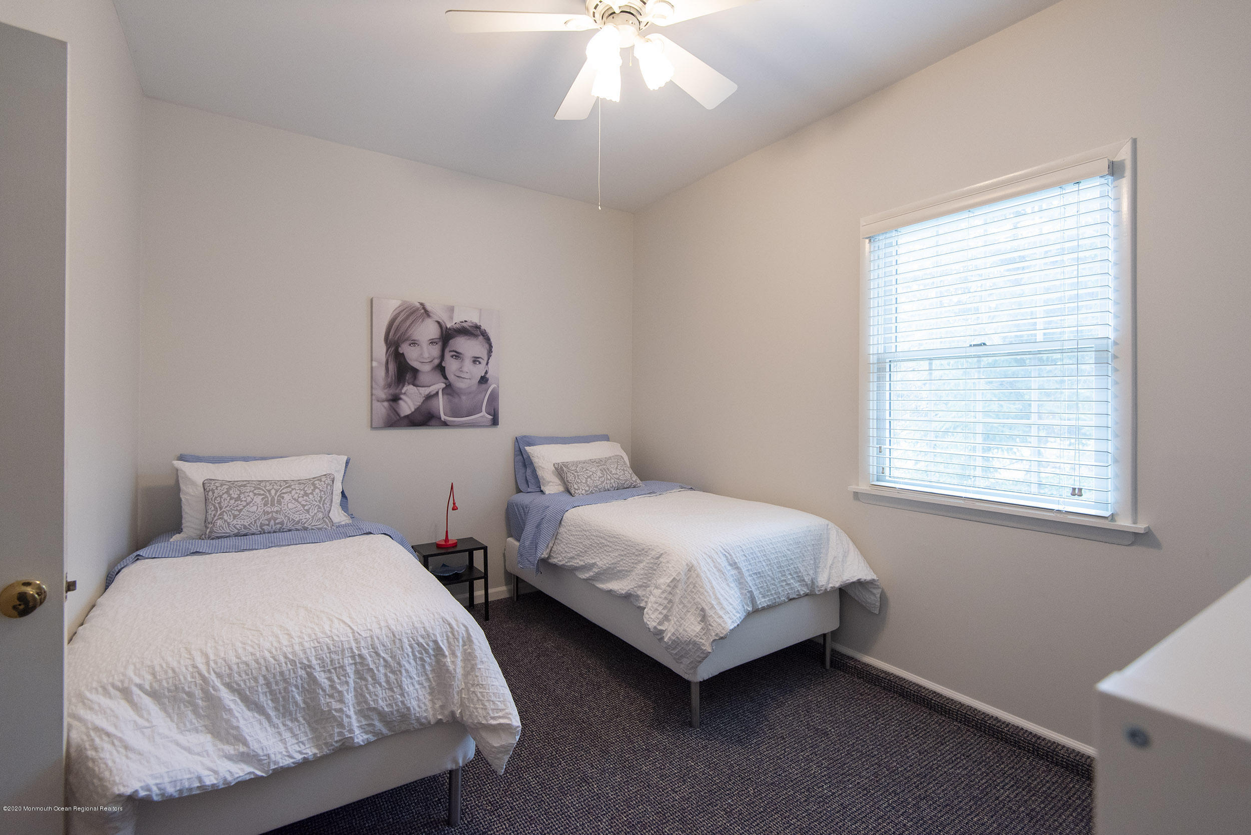 45 Hance Road Fair Haven, NJ 07704 - Photo 19 of 35 a bedroom with two beds and a table