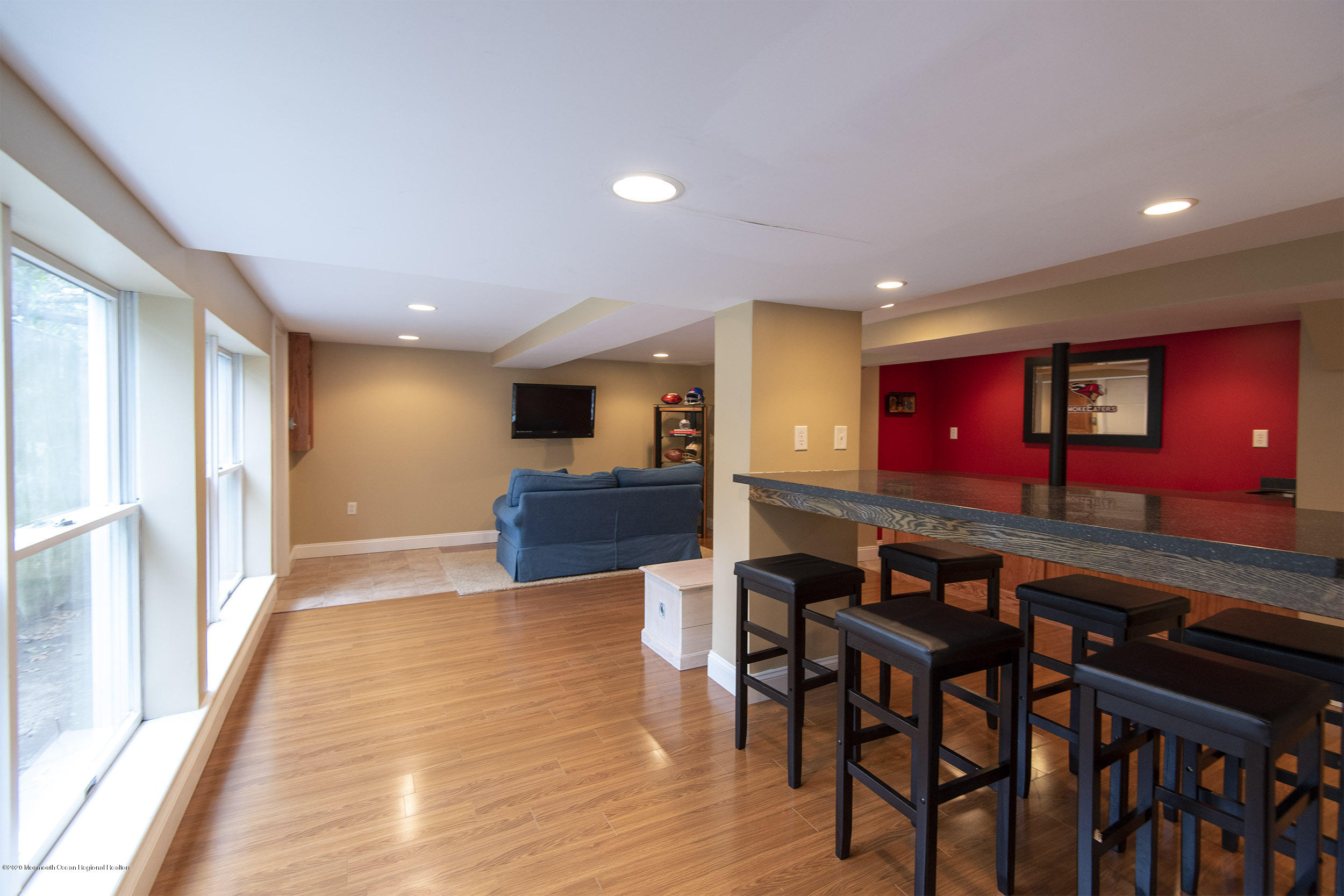 45 Hance Road Fair Haven, NJ 07704 - Photo 23 of 35 a kitchen with stainless steel appliances kitchen island granite countertop a dining table chairs and a refrigerator