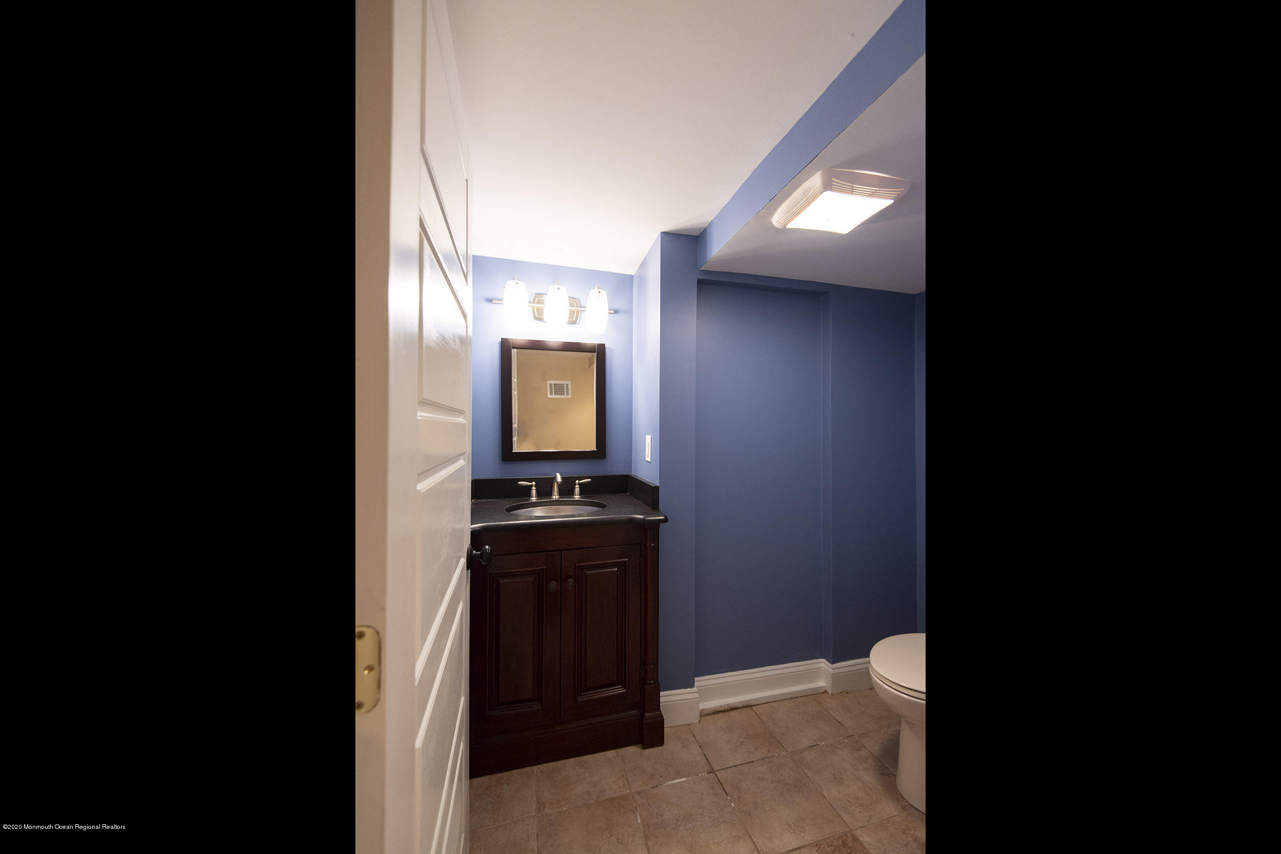 45 Hance Road Fair Haven, NJ 07704 - Photo 25 of 35 a bathroom with a toilet sink and mirror