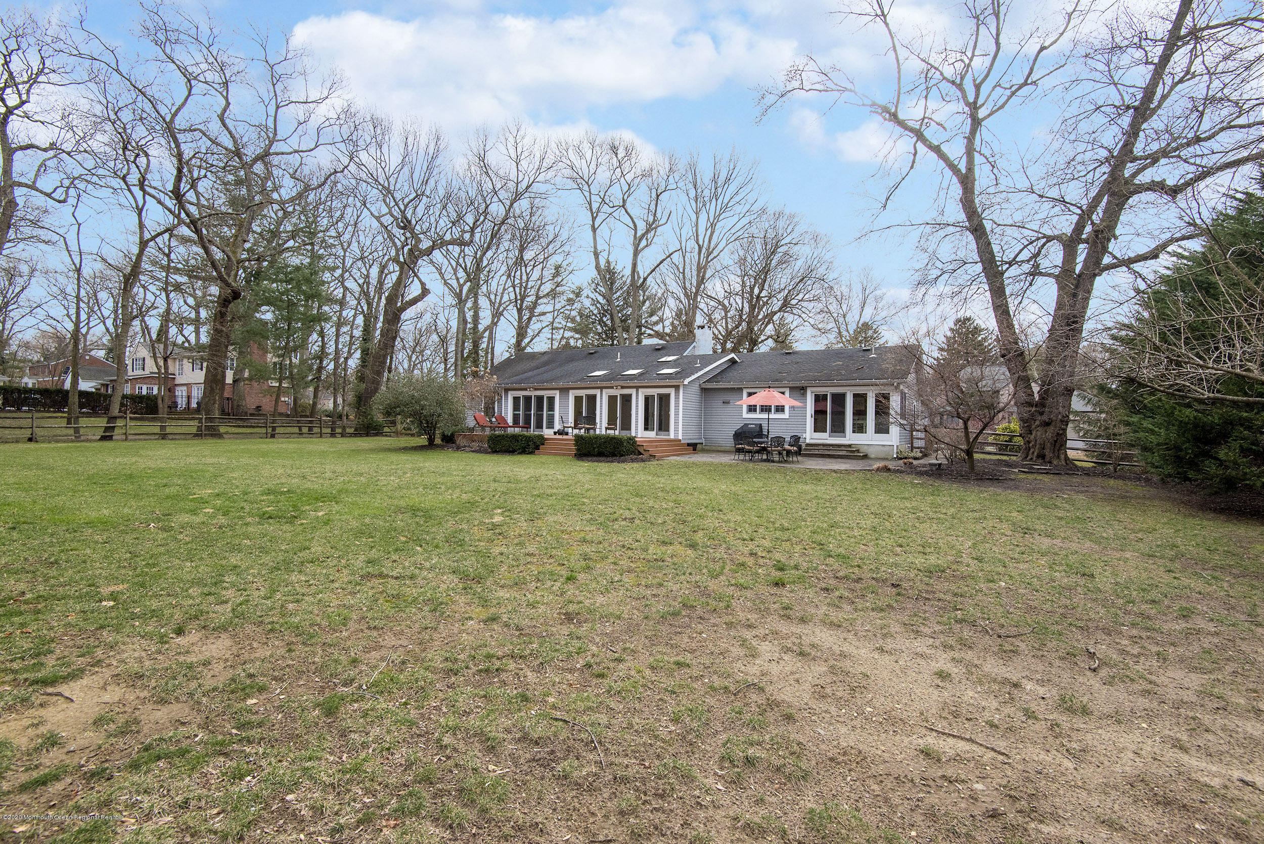 45 Hance Road Fair Haven, NJ 07704 - Photo 26 of 35 a front view of house with yard and trees in the background