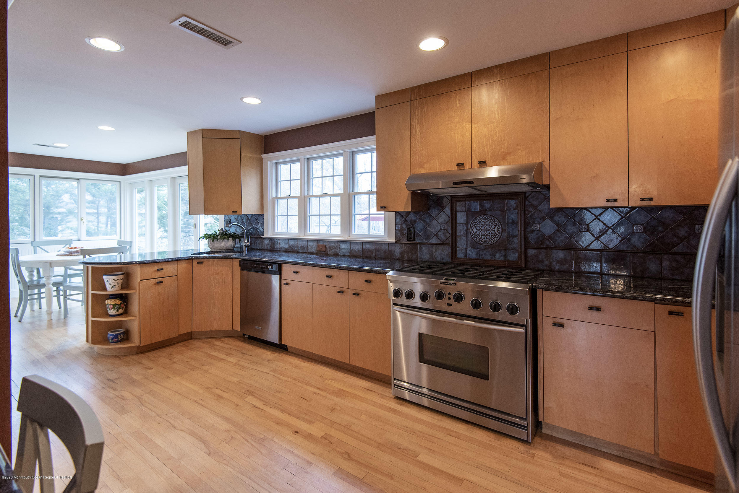 45 Hance Road Fair Haven, NJ 07704 - Photo 8 of 35 a kitchen with stainless steel appliances granite countertop wooden cabinets a sink a stove a refrigerator and island with wooden floor