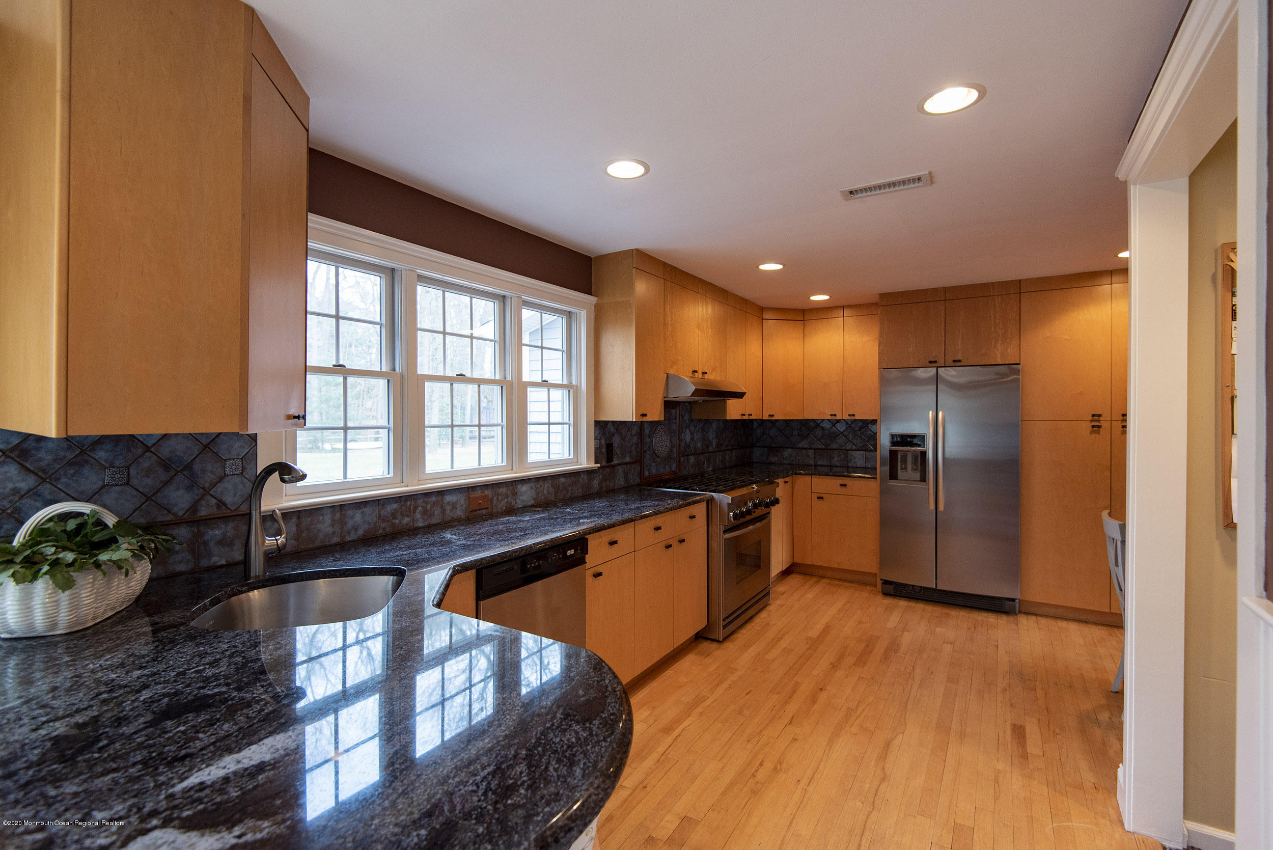 45 Hance Road Fair Haven, NJ 07704 - Photo 10 of 35 a large kitchen with stainless steel appliances granite countertop a stove a sink and a refrigerator
