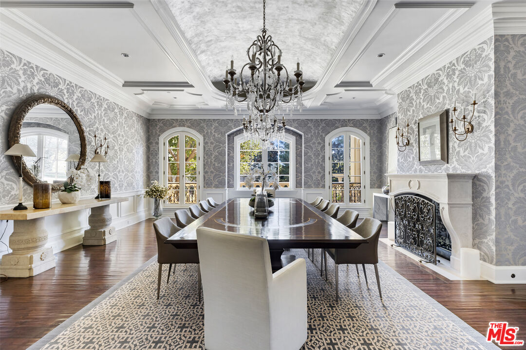 71 Beverly Park Beverly Hills, CA 90210 - Photo 13 of 45 a view of a dining room with furniture wooden floor and a chandelier