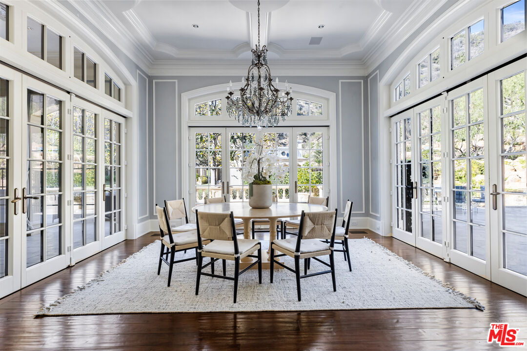 71 Beverly Park Beverly Hills, CA 90210 - Photo 17 of 45 a view of a dining room with furniture window and wooden floor