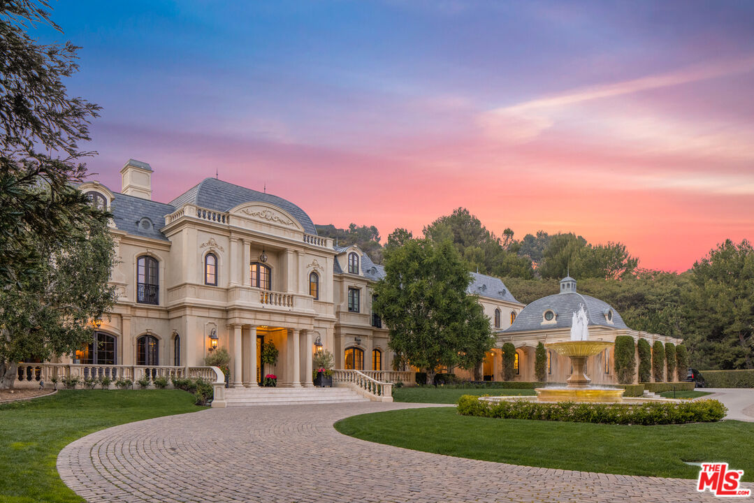 71 Beverly Park Beverly Hills, CA 90210 - Photo 2 of 45 a front view of a house with a yard