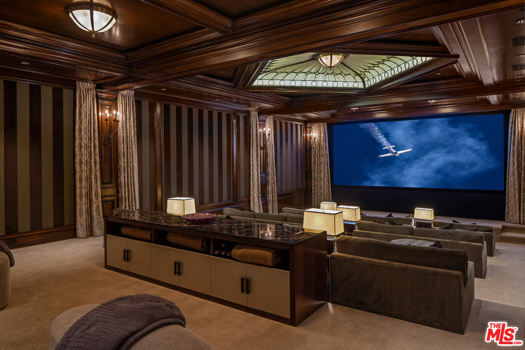 71 Beverly Park Beverly Hills, CA 90210 - Photo 31 of 45 a room with furniture and flat screen tv