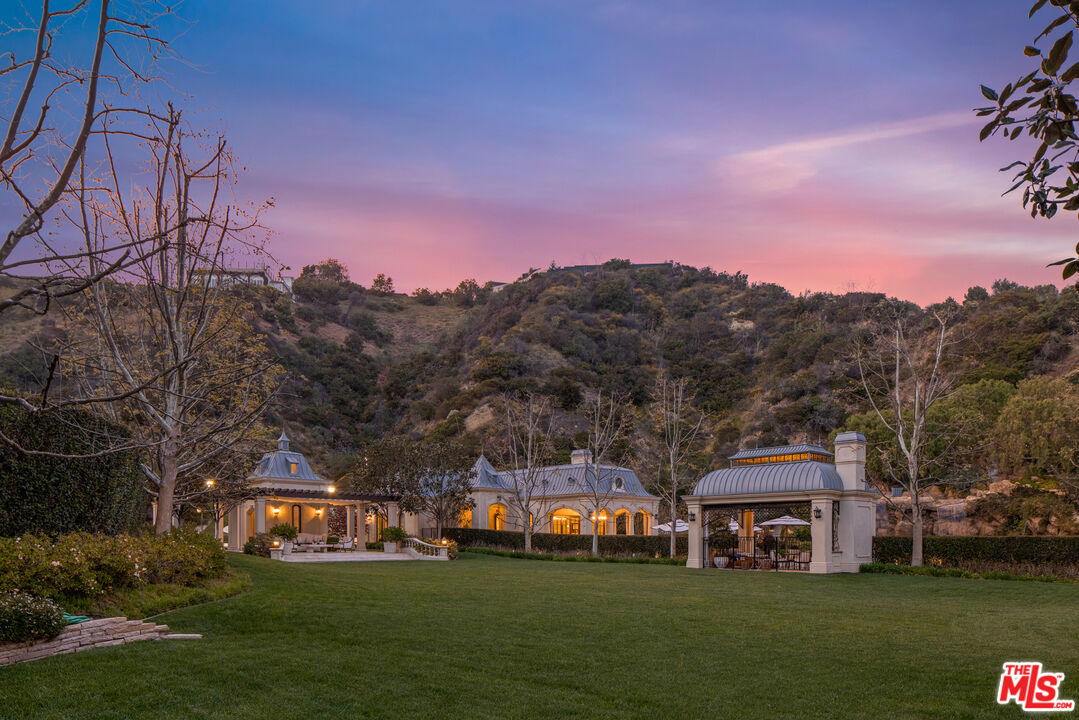 71 Beverly Park Beverly Hills, CA 90210 - Photo 43 of 45 a front view of a house with garden