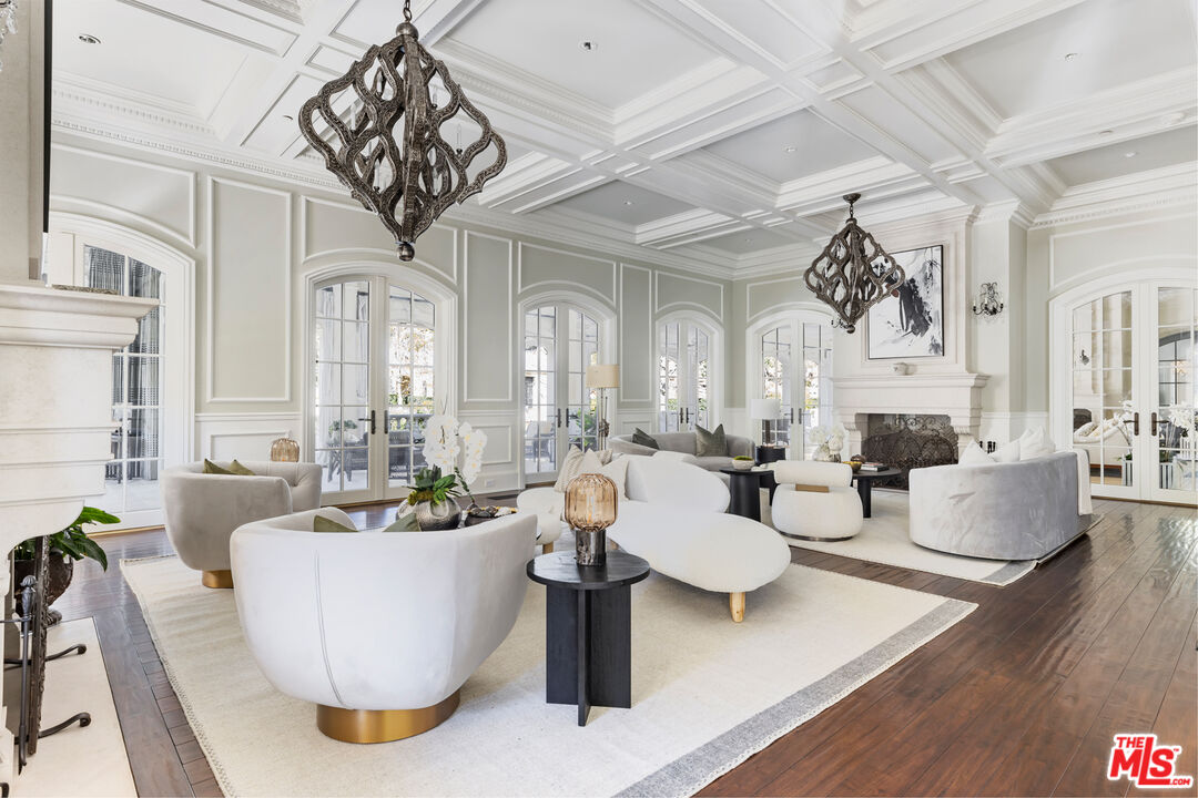 71 Beverly Park Beverly Hills, CA 90210 - Photo 7 of 45 a living room with fireplace furniture and a wooden floor