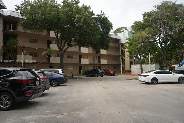 a view of street with parked cars