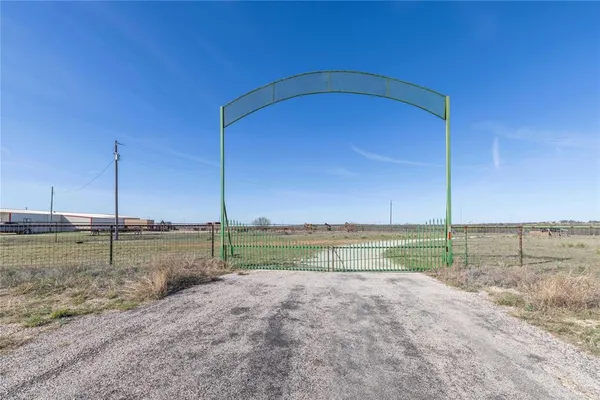 a view of a big yard next to a lake