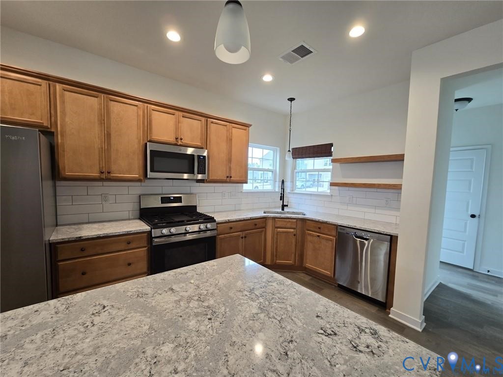 7825 Old Guild Road Richmond, VA 23237 - Photo 11 of 27 Kitchen featuring expansive counter space, wood ca