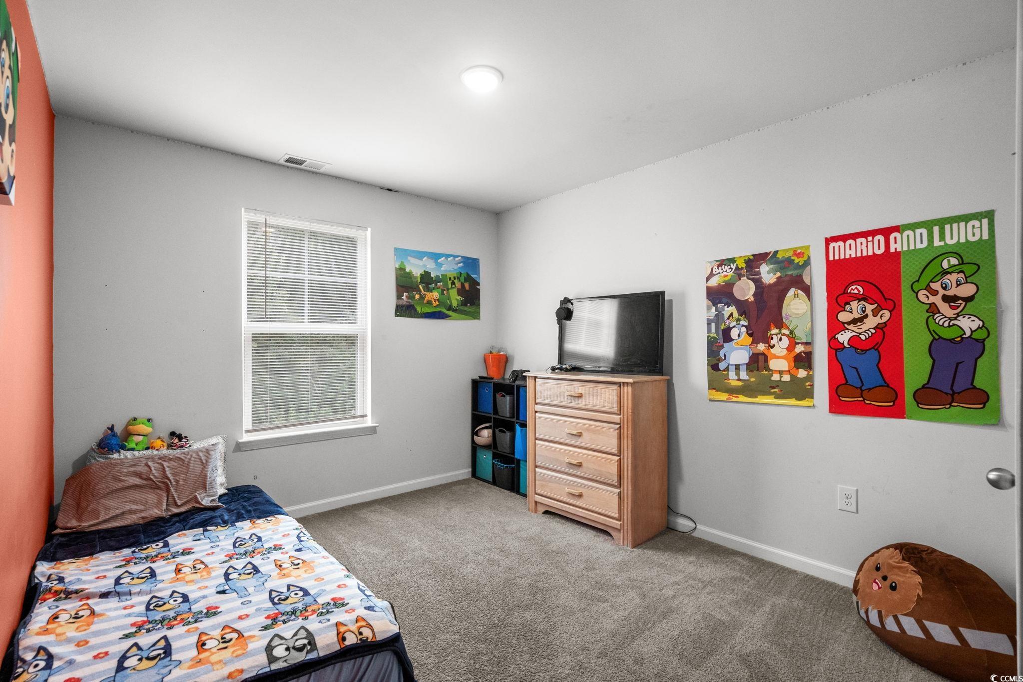 899 Snowberry Drive Longs, SC 29568 - Photo 15 of 27 Bedroom featuring light carpet and baseboards