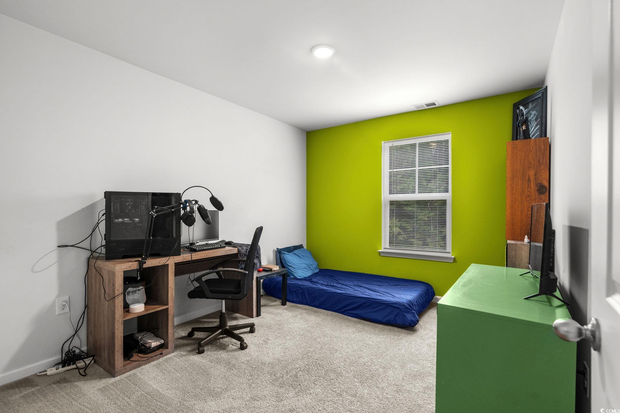 899 Snowberry Drive Longs, SC 29568 - Photo 16 of 27 Carpeted bedroom with a desk