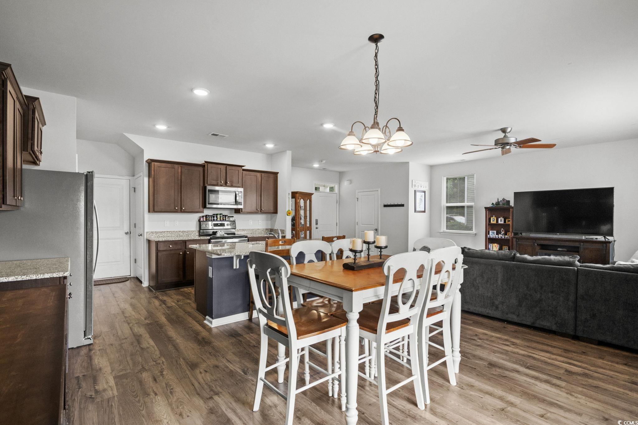 899 Snowberry Drive Longs, SC 29568 - Photo 7 of 27 Dining space with a chandelier, dark wood finished floors, recessed lighting, and a ceiling fan