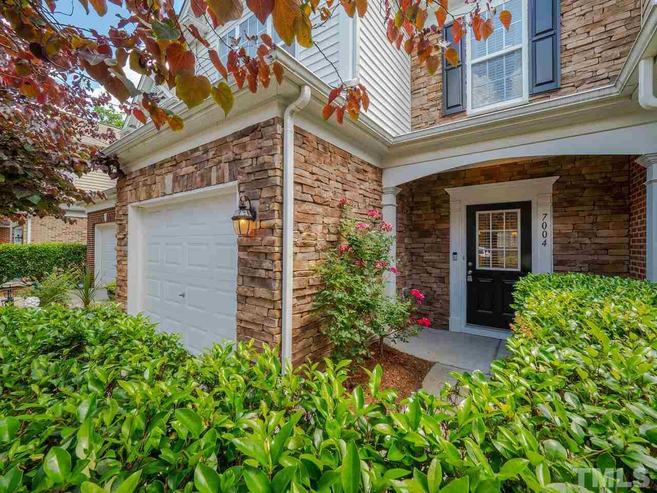 7004 Racine Way Raleigh, NC 27690 - Photo 3 of 27 front view of a house with potted plants