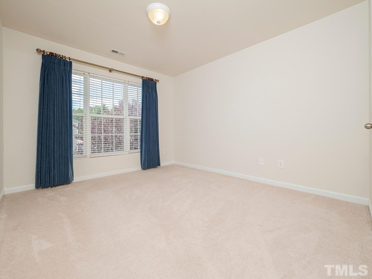 7004 Racine Way Raleigh, NC 27690 - Photo 22 of 27 a view of an empty room with a window