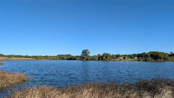 a view of lake with sunset