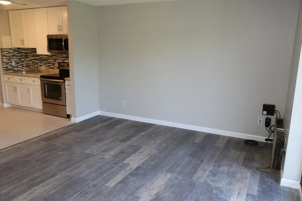 a kitchen with a sink and a stove top oven