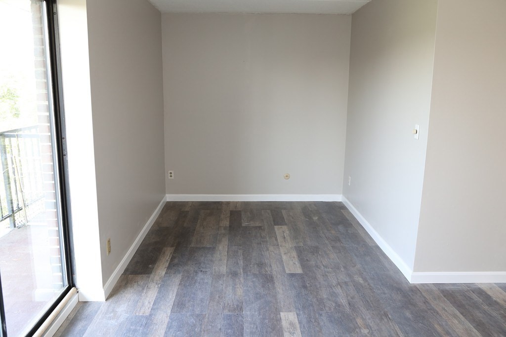 40 Cochituate Road, Unit 45 Framingham, MA 01701 - Photo 6 of 9 a view of a room with wooden floor