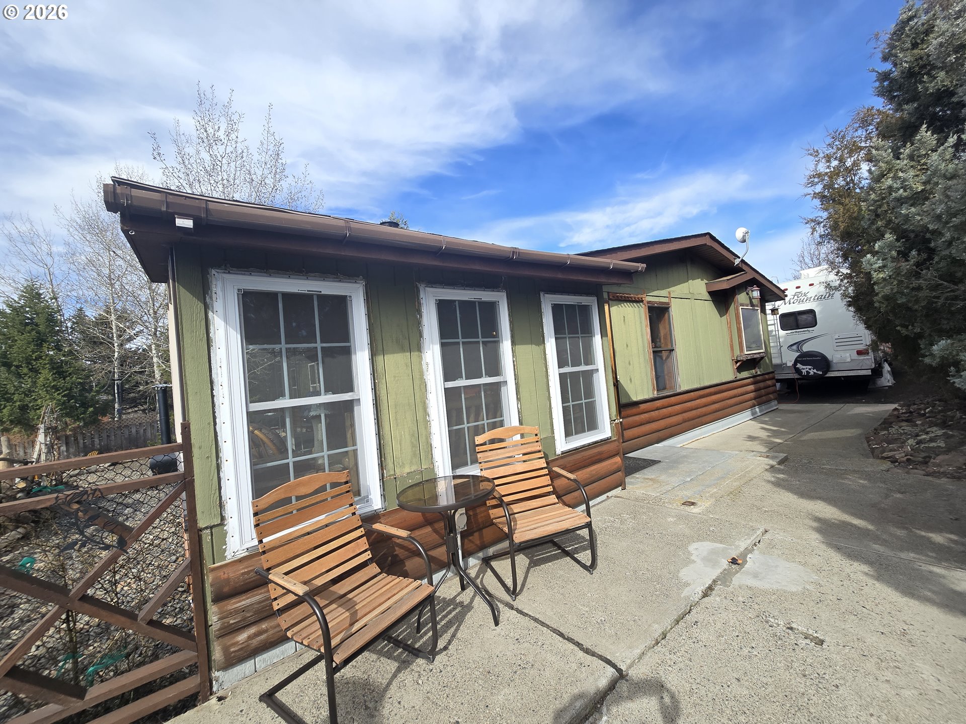 704 Residence Street Enterprise, OR 97828 - Photo 3 of 26 a view of a house with backyard and sitting area
