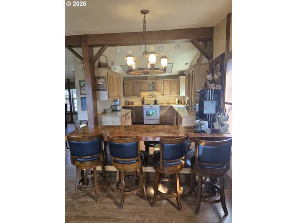 a view of a dining room with furniture window and outside view