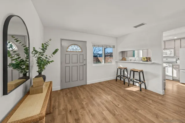 a view of a livingroom with furniture and wooden floor