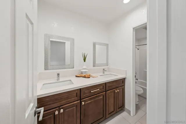 a bathroom with a shower and a sink