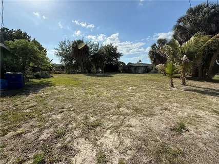 a view of a yard with an trees