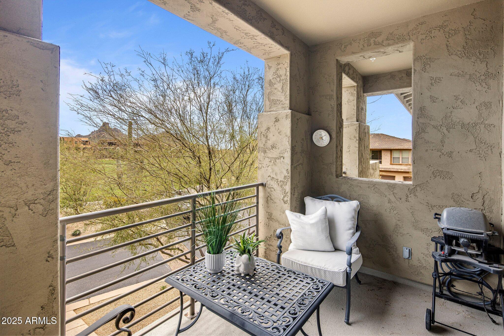 10260 East White Feather Lane, Unit 2003 Scottsdale, AZ 85262 - Photo 18 of 24 a living room with furniture and wooden floor