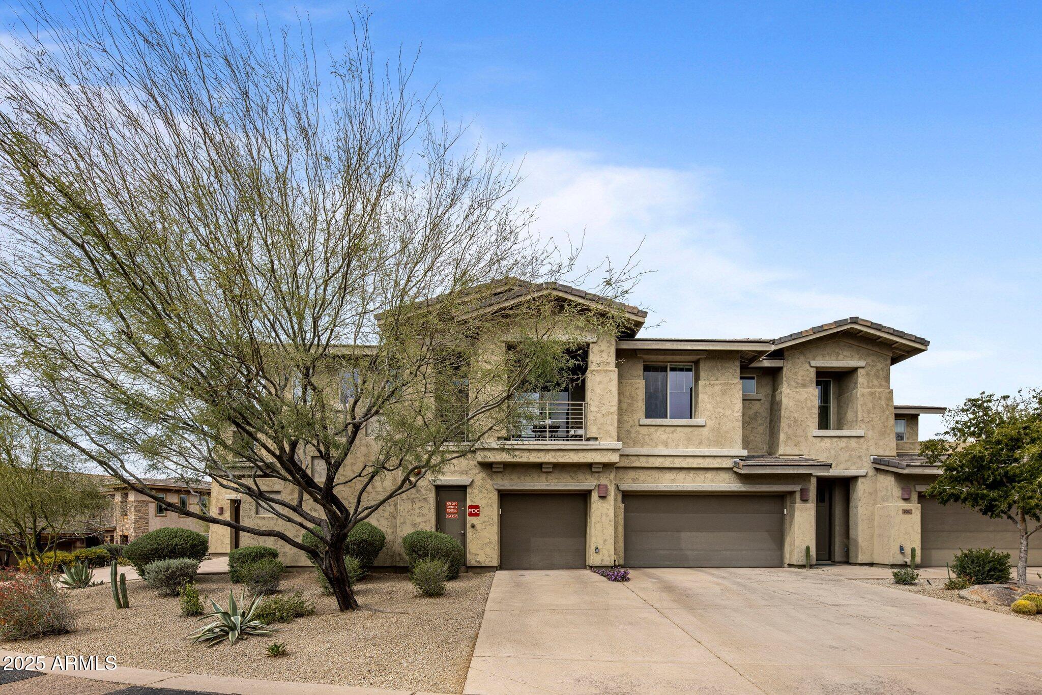 10260 East White Feather Lane, Unit 2003 Scottsdale, AZ 85262 - Photo 19 of 24 a front view of a house with a yard