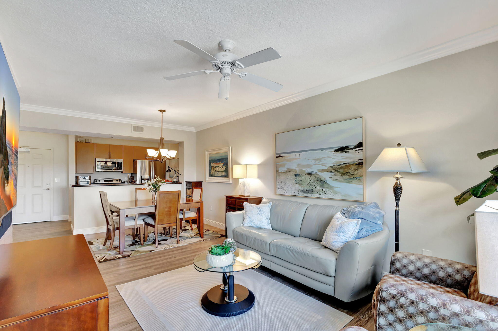 4903 Midtown Lane, Unit 3313 Palm Beach Gardens, FL 33418 - Photo 12 of 81 a living room with furniture and a lamp