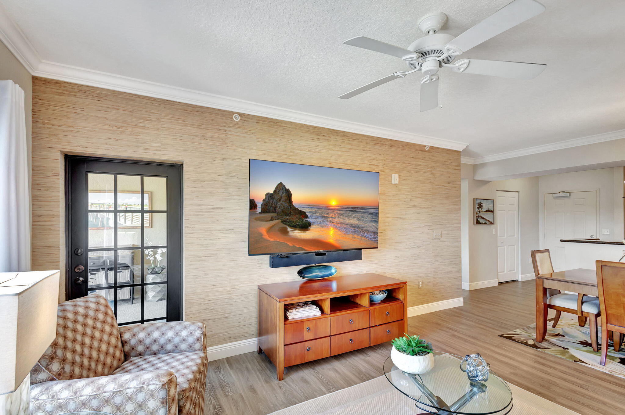 4903 Midtown Lane, Unit 3313 Palm Beach Gardens, FL 33418 - Photo 13 of 81 a living room with furniture and a flat screen tv