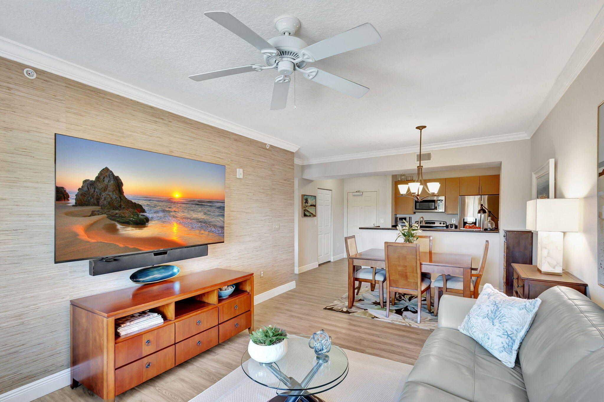 4903 Midtown Lane, Unit 3313 Palm Beach Gardens, FL 33418 - Photo 14 of 81 a living room with furniture and a flat screen tv