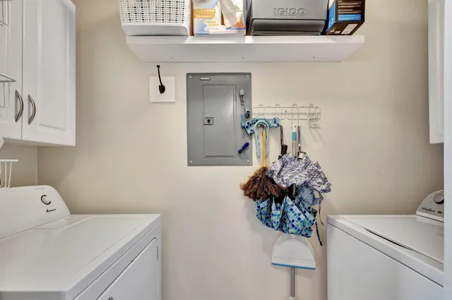 a view of a balcony with furniture and floor to ceiling window