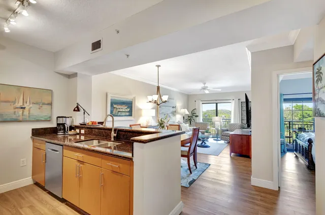 a kitchen with a sink stove and wooden cabinets