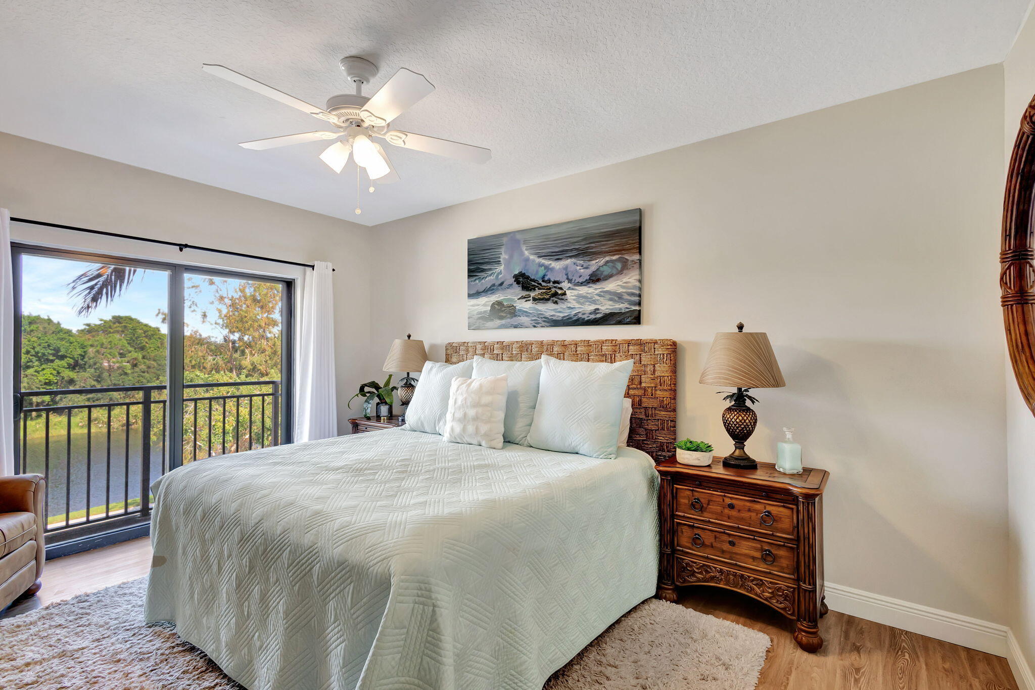 4903 Midtown Lane, Unit 3313 Palm Beach Gardens, FL 33418 - Photo 22 of 81 a bed sitting in a bedroom next to a window