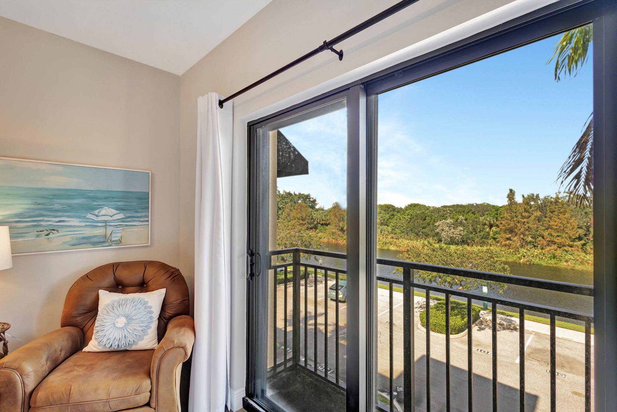 4903 Midtown Lane, Unit 3313 Palm Beach Gardens, FL 33418 - Photo 23 of 81 a view of a balcony with furniture and floor to ceiling window