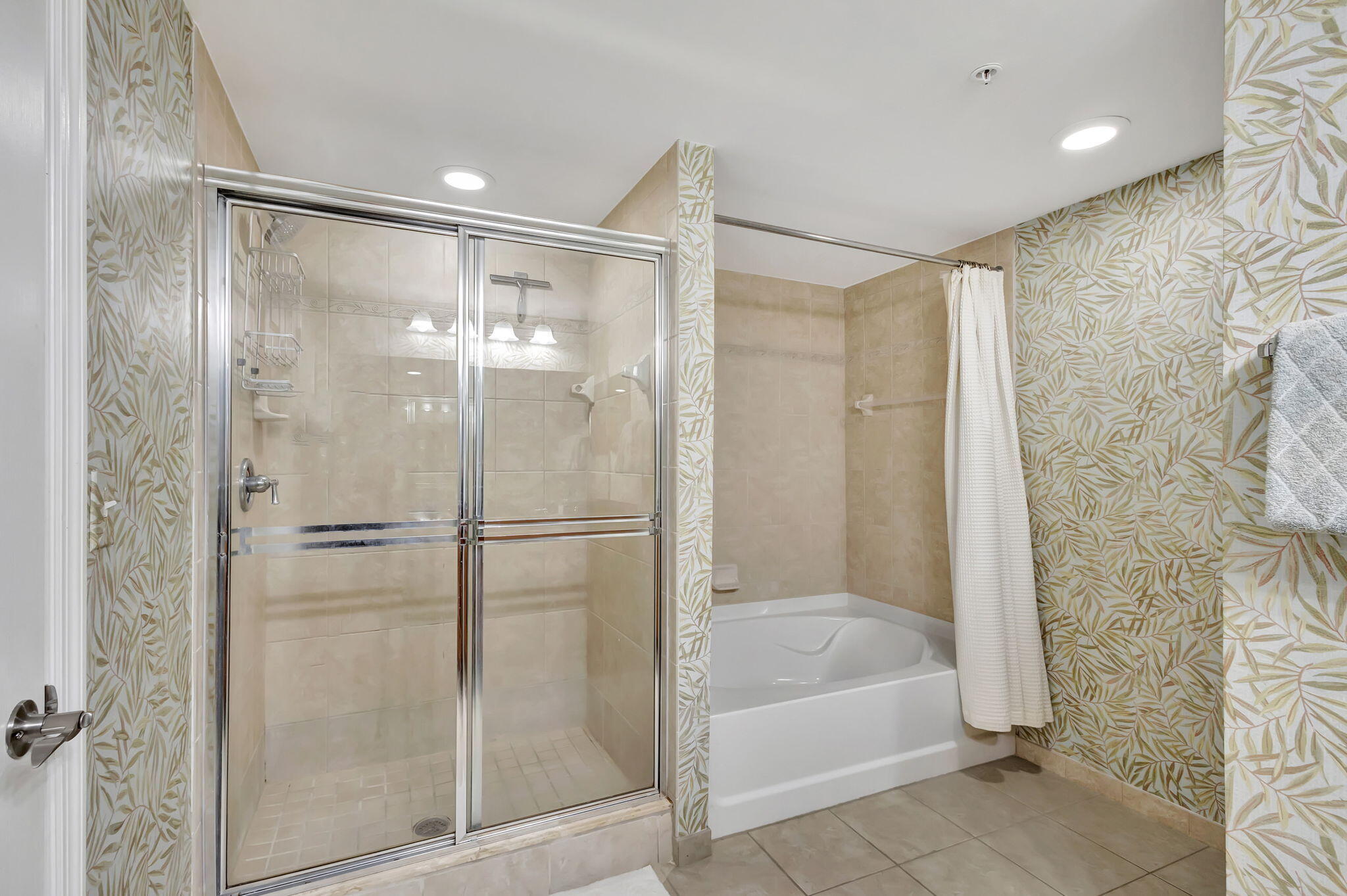 4903 Midtown Lane, Unit 3313 Palm Beach Gardens, FL 33418 - Photo 26 of 81 a bathroom with a bathtub and a shower