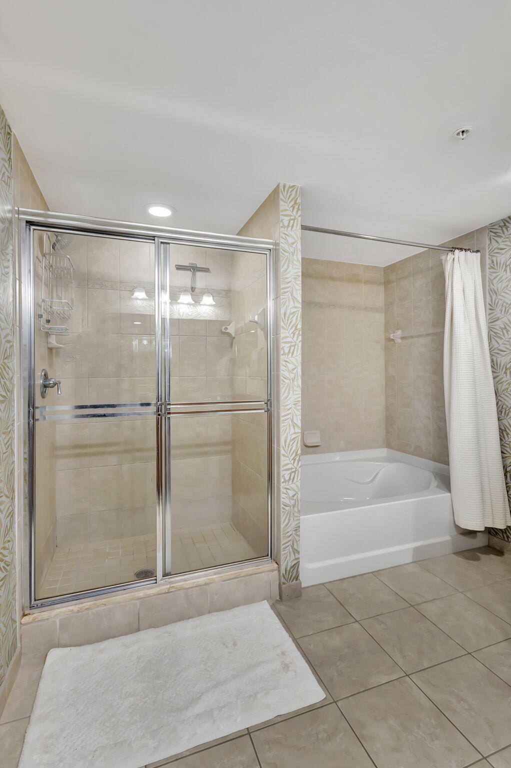 4903 Midtown Lane, Unit 3313 Palm Beach Gardens, FL 33418 - Photo 27 of 81 a bathroom with a bathtub and a shower
