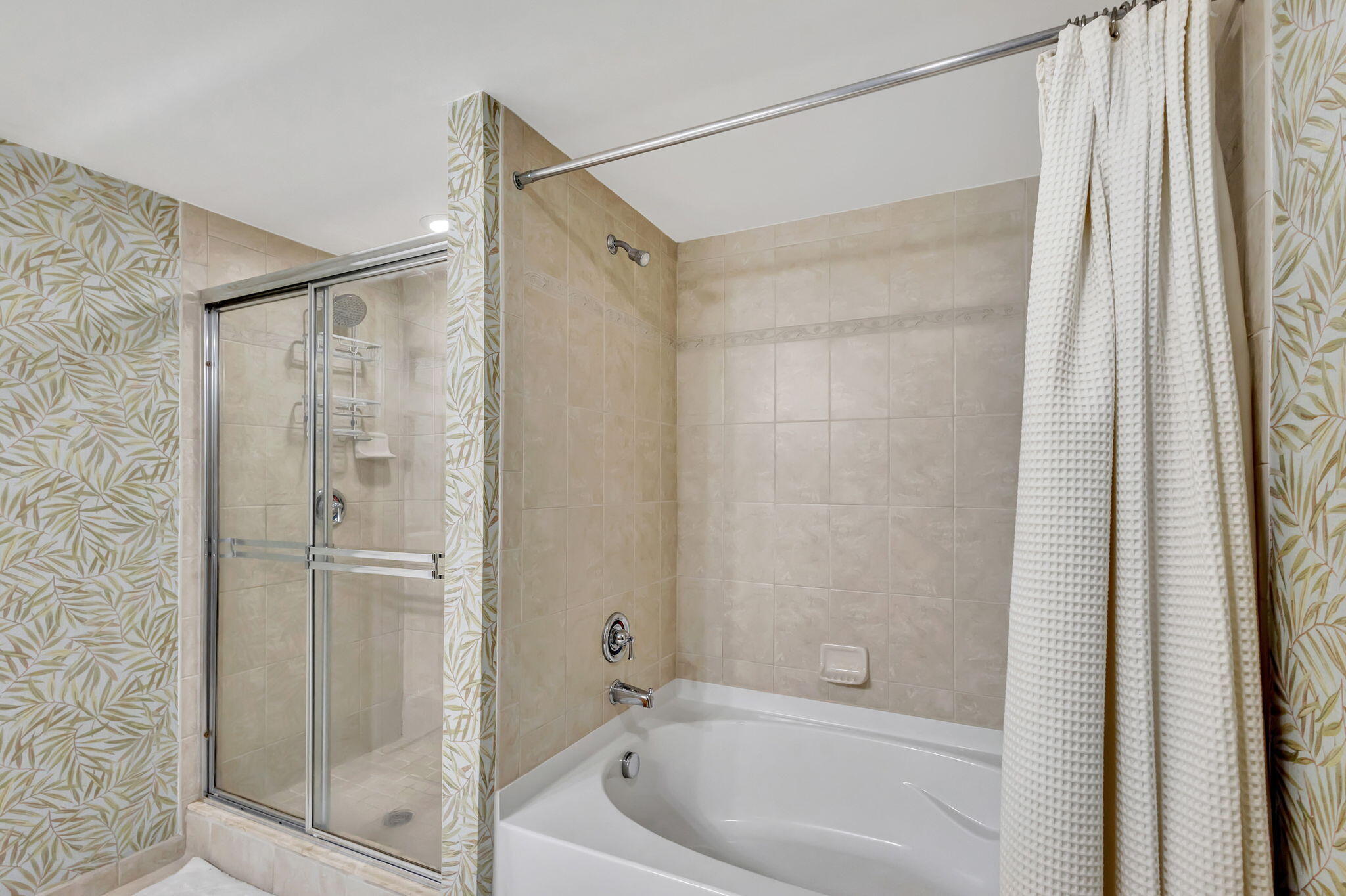 4903 Midtown Lane, Unit 3313 Palm Beach Gardens, FL 33418 - Photo 28 of 81 a bathroom with a bathtub and a shower