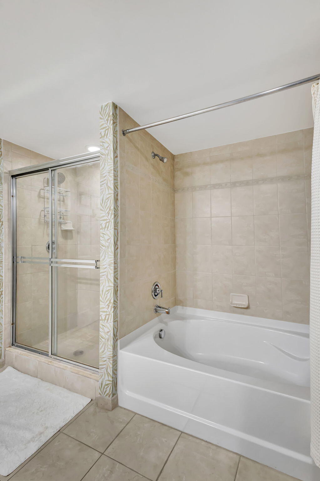4903 Midtown Lane, Unit 3313 Palm Beach Gardens, FL 33418 - Photo 29 of 81 a bathroom with a bathtub and a shower