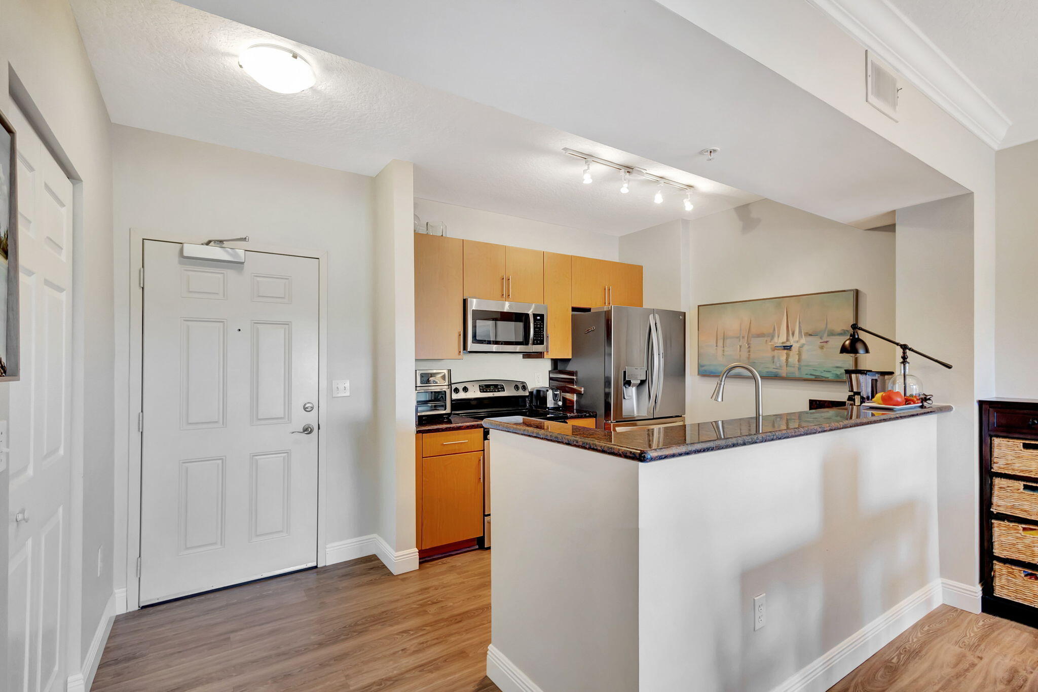 4903 Midtown Lane, Unit 3313 Palm Beach Gardens, FL 33418 - Photo 3 of 81 a kitchen with stainless steel appliances a refrigerator and a stove top oven