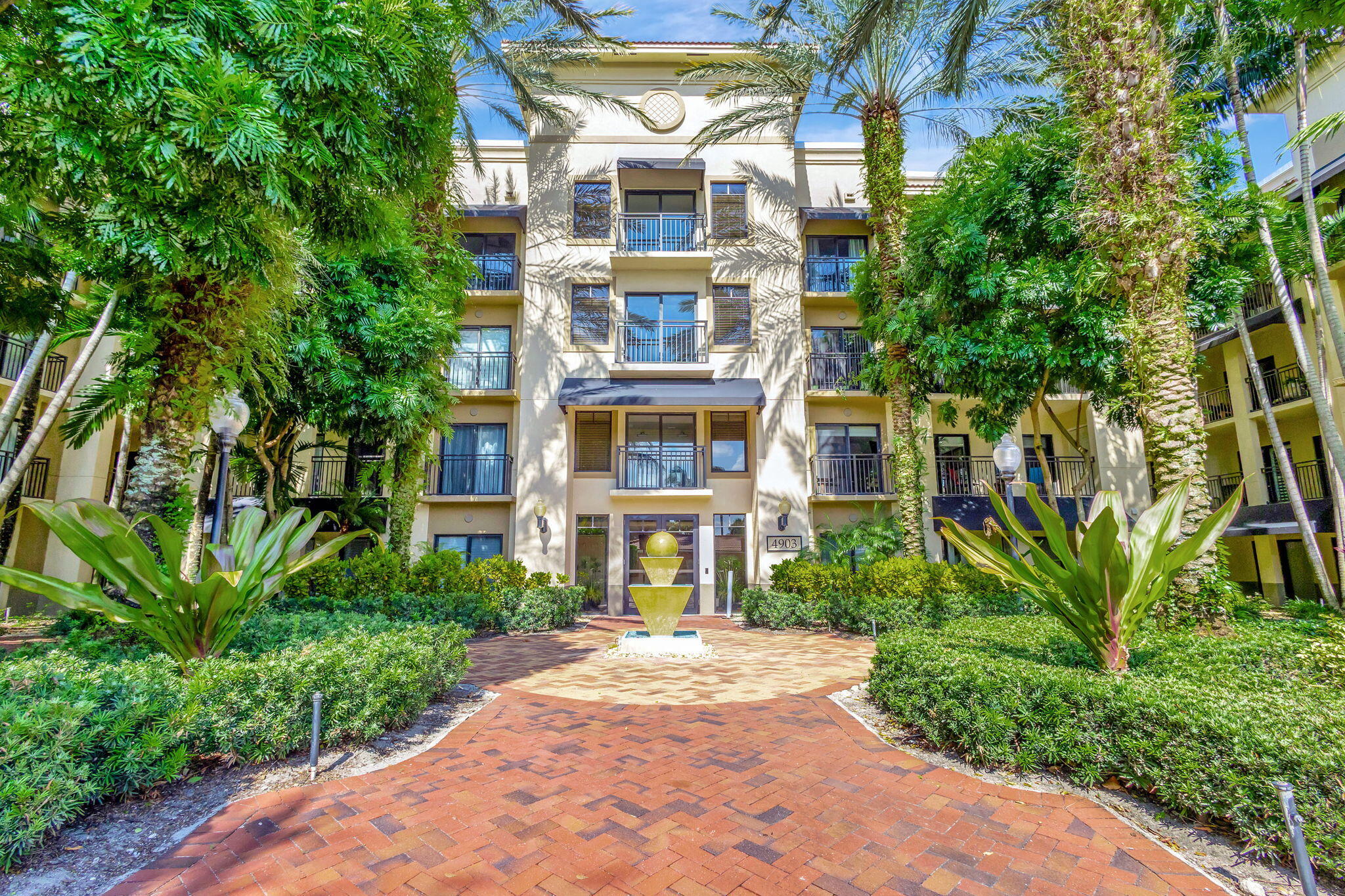 4903 Midtown Lane, Unit 3313 Palm Beach Gardens, FL 33418 - Photo 36 of 81 a front view of a multi story residential apartment buildings