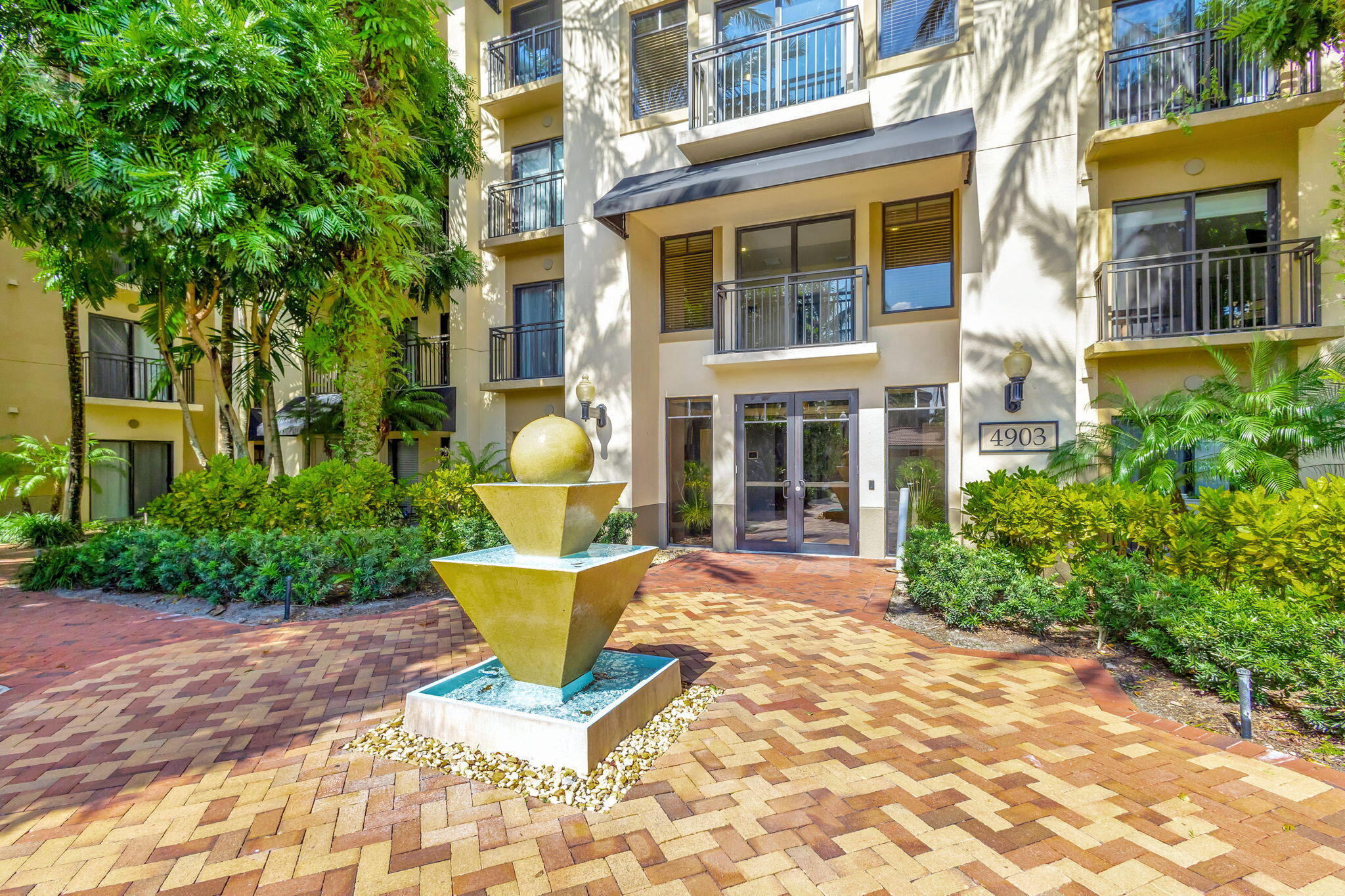 4903 Midtown Lane, Unit 3313 Palm Beach Gardens, FL 33418 - Photo 37 of 81 a view of a building with a outdoor space